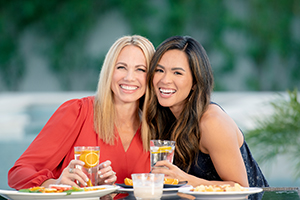 Two women smiling.